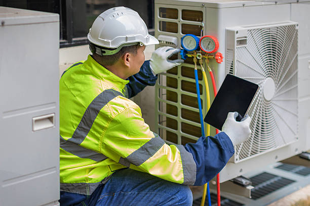 Professional Heat Pump Repair technician working in Bagdad, AZ
